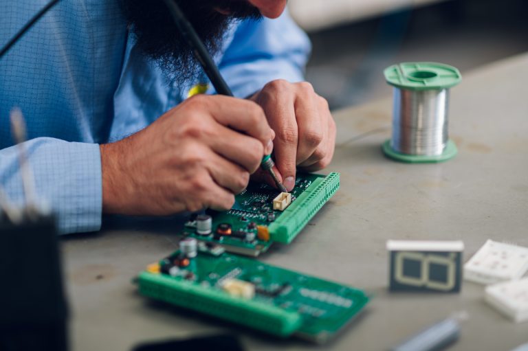 26 electronics-engineer-working-in-a-workshop-with